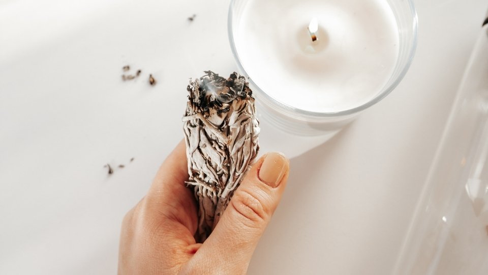 cleansing crystals with sage smudge stick