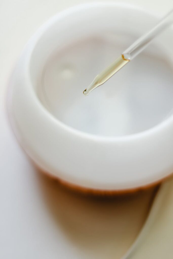 essential oil pipette and white round plastic bowl